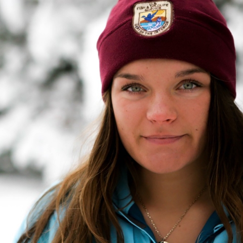 woman in FWS hat in the snow