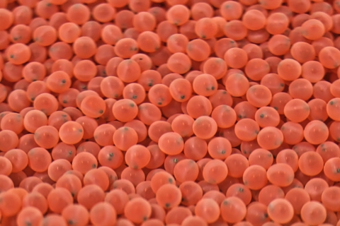 A large collection of tiny pink spheres