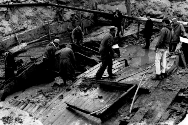 Men in the hull of the Steamboat Bertrand excavating artifacts.